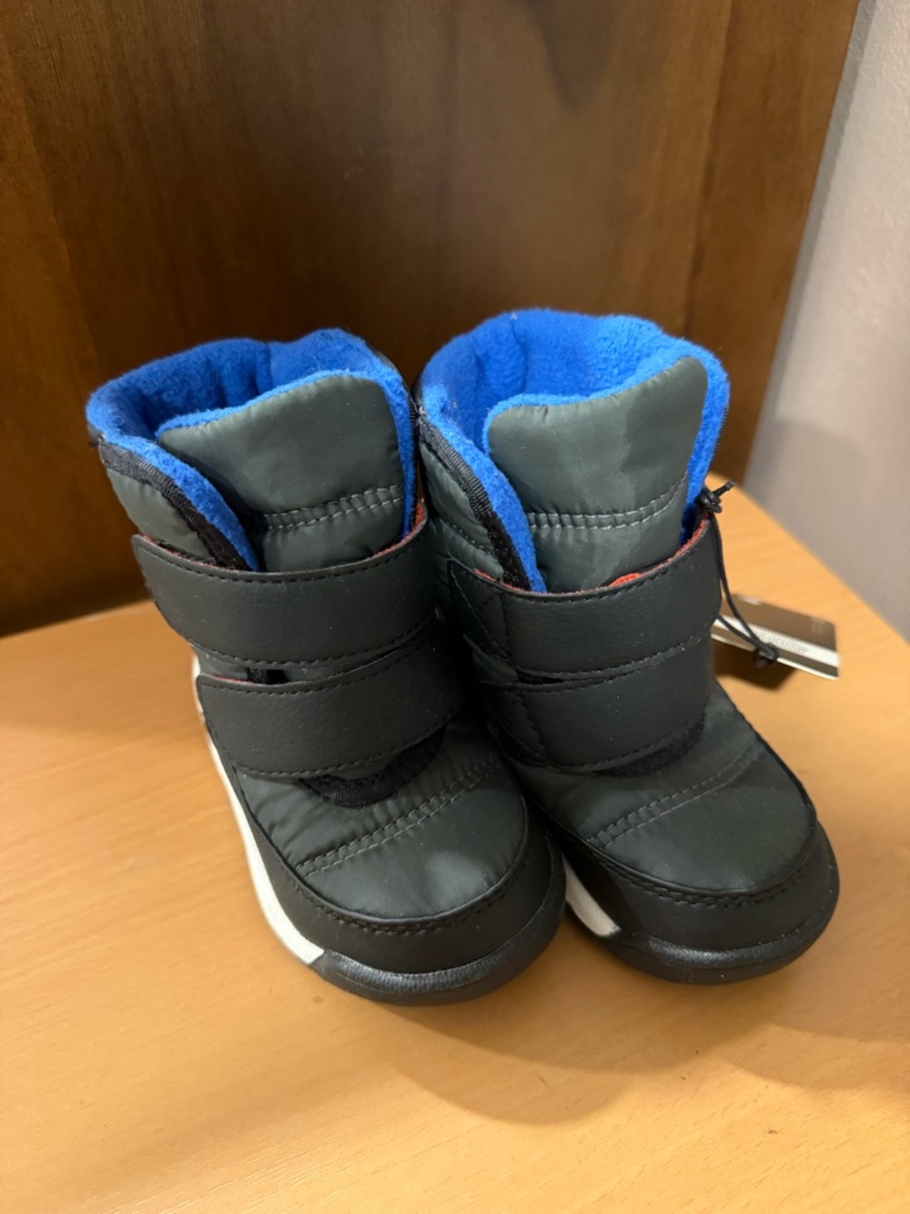 Sorel Kids Black Boots with Bright Blue Fleece Lining